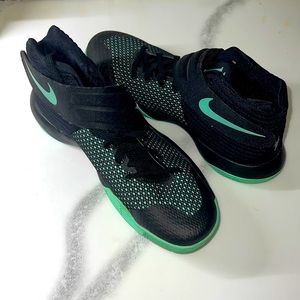 Nike Kyrie 2: Sleek black & green, designed for agility on the court.
